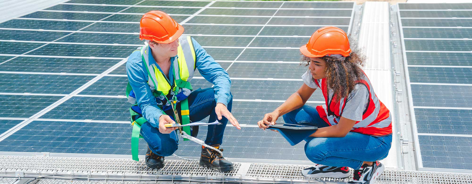 Engineer and inspector inspecting solar panel