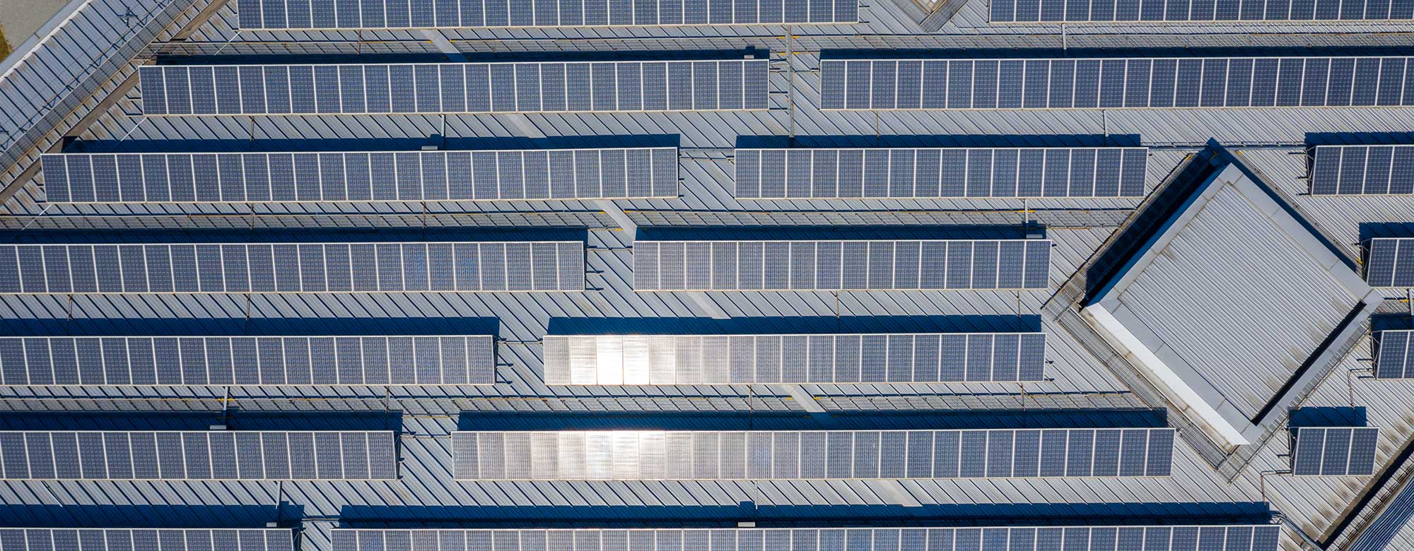 Arial view of factory roof with solar panels